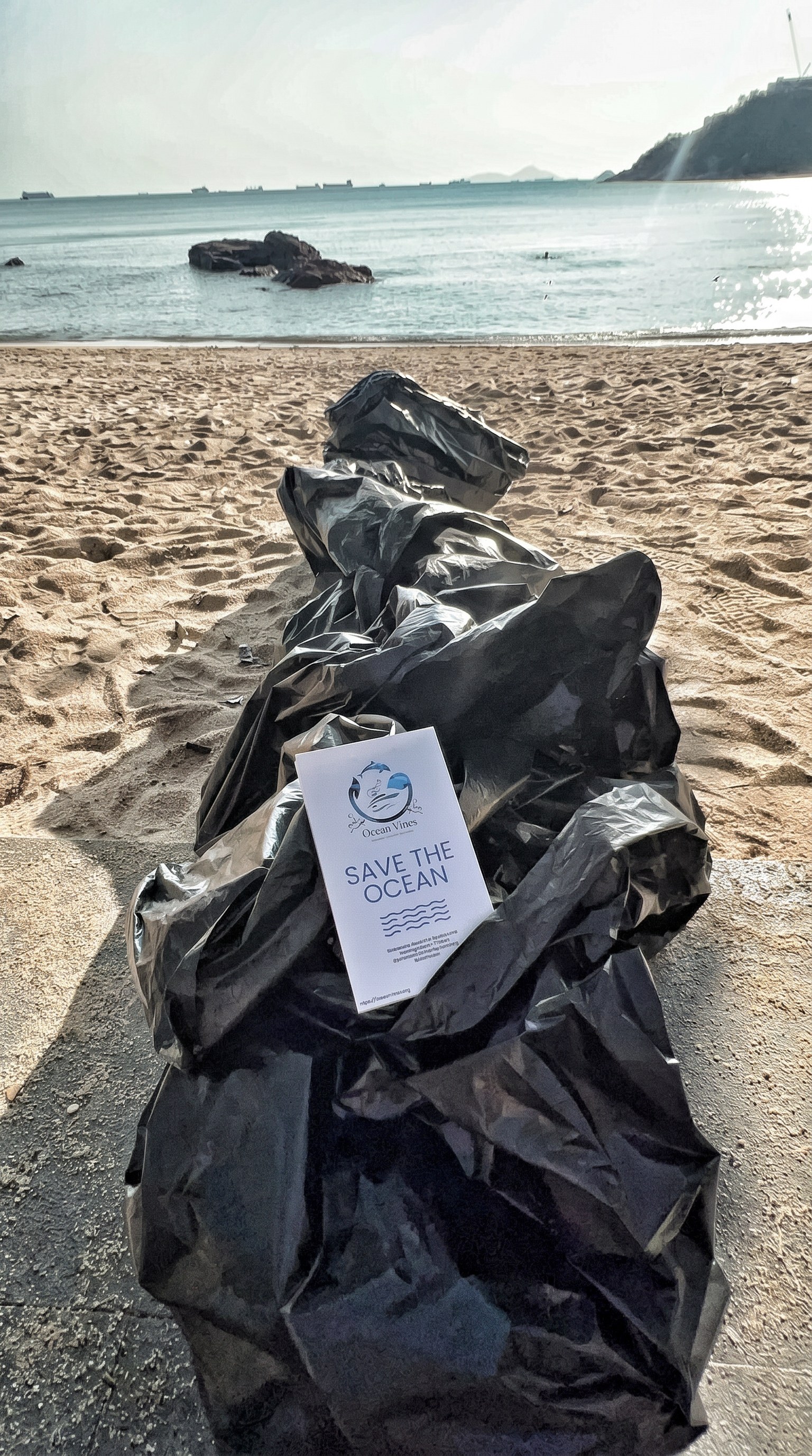 Bags of waste collected at an OceanVines beach cleanup