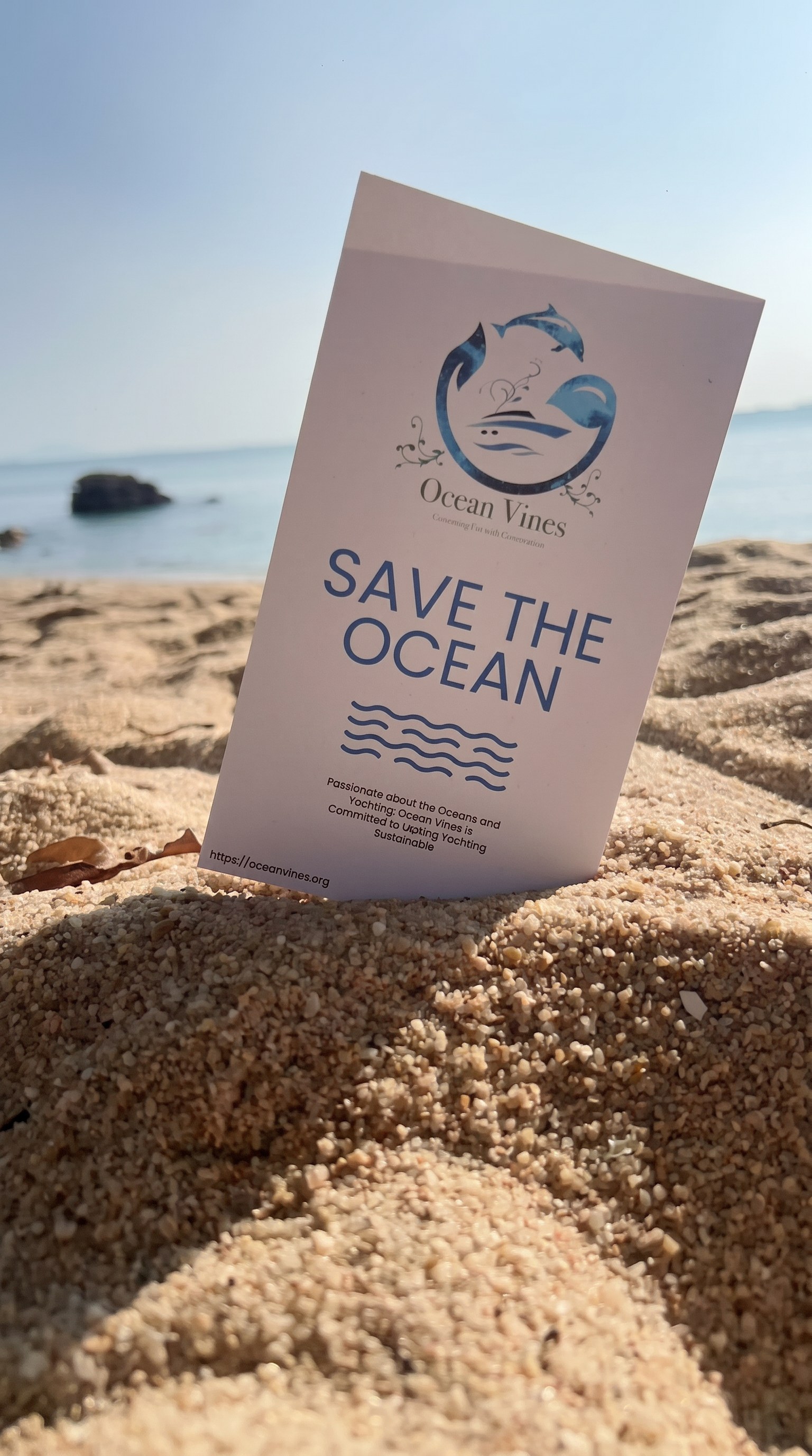 OceanVines Save The Ocean leaflet on a Hong Kong beach